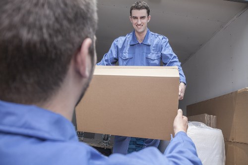 Removal van and movers preparing a house move in Upper Clapton