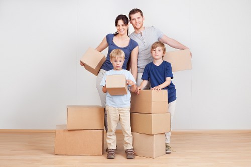Unpacking boxes in an Upper Clapton property after a move