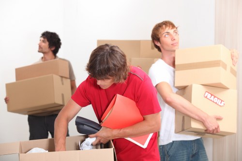 Packed boxes and furniture ready for collection by a removals company