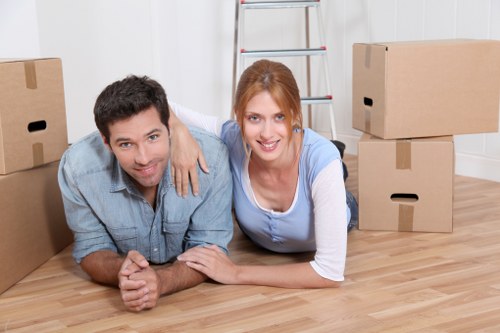 Loading furniture into a hired removal truck on a residential street