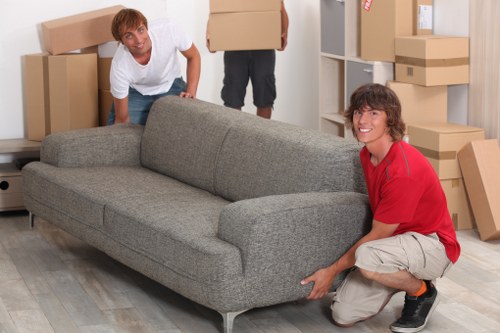 Careful furniture loading outside a residential property in Upper Clapton