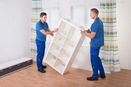 Professional removals crew loading items for a local office relocation